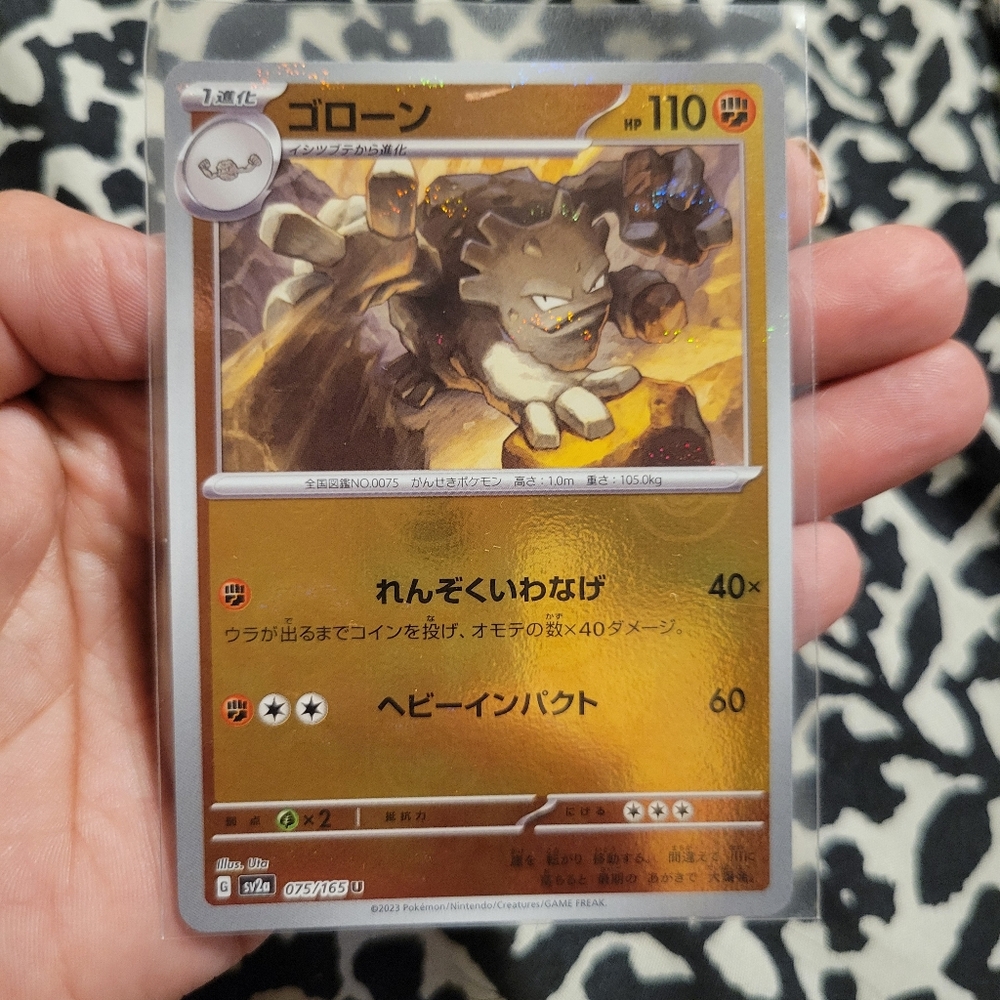 Pokemon Card With Golem Illustration